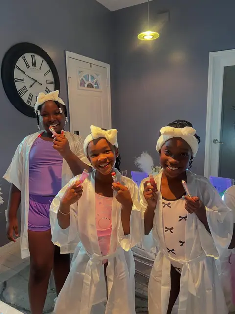 Kids in spa robes and headbands at a Slumberr spa party