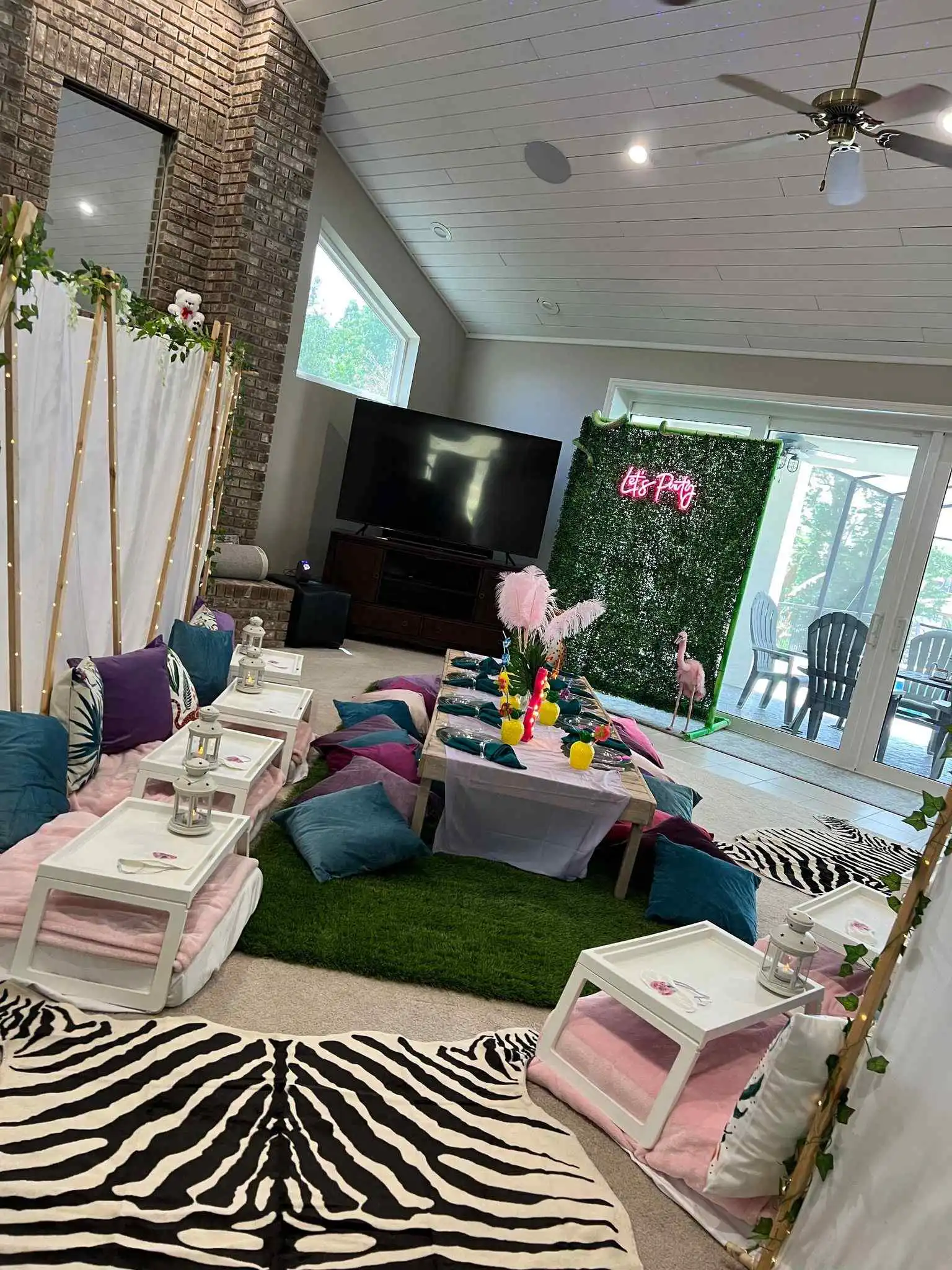 A living room with the Ultimate Movie Night Setup Training Package - Transform Your Events rug and Ultimate Movie Night Setup Training Package - Transform Your Events pillows.